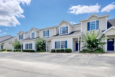 Townhome / multi-family property with uncovered parking