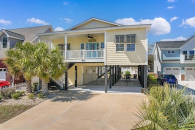 Raised beach house with stairs, driveway, a ceilin