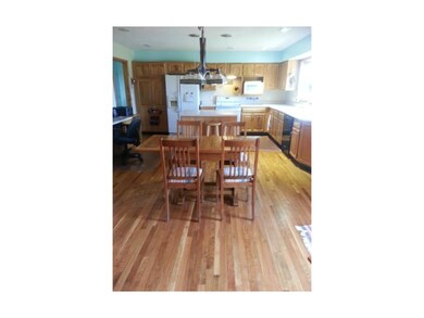 kitchen with island and desk area to the left