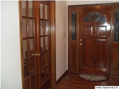 Oak French doors that lead to large formal living 