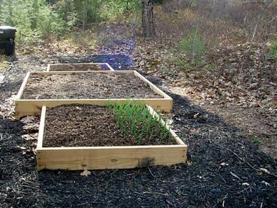 Exterior Front. Raised bed garden...