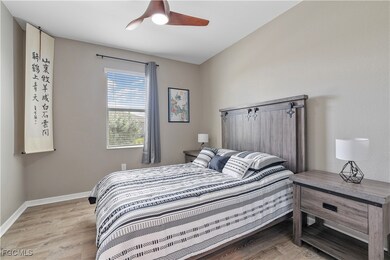 Bedroom featuring light wood-type flooring and ceiling fan