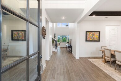 Step inside to soaring ceilings, natural light, an