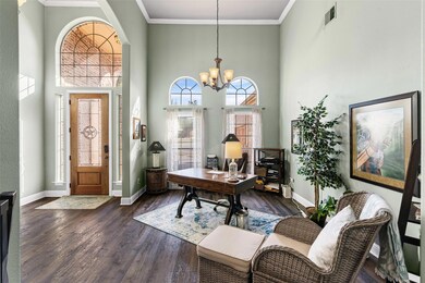 Crown moldings in entry, office to the right, and 