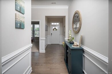Welcoming Entry with engineered hardwood floors throughout