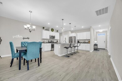 Dining area featuring sink, light hardwood / wood-