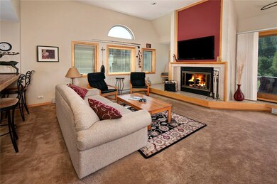 Large living room with high ceilings and wood burn
