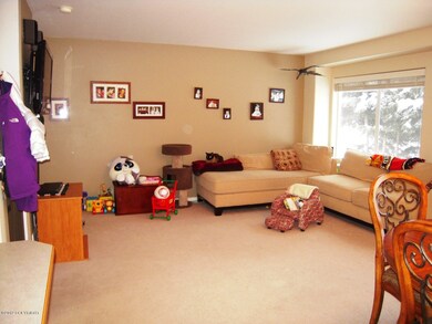 Spacious Living Room views treed yard