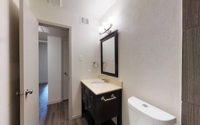 Bathroom featuring hardwood / wood-style floors, v