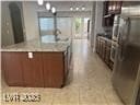 Kitchen with brown cabinets and light countertops