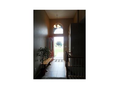 Foyer. Beautiful front entryway with grand arch en