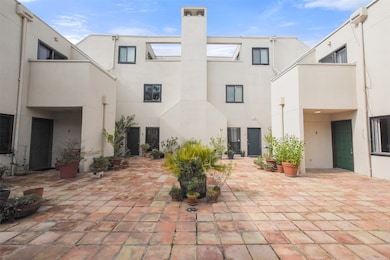The upstairs courtyard outside the unit (located t