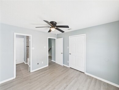 Unfurnished bedroom featuring light wood-type floo