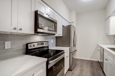 The kitchen features all stainless appliances and