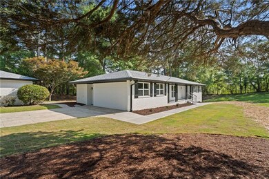 Ranch-style house with brick siding, a front yard,