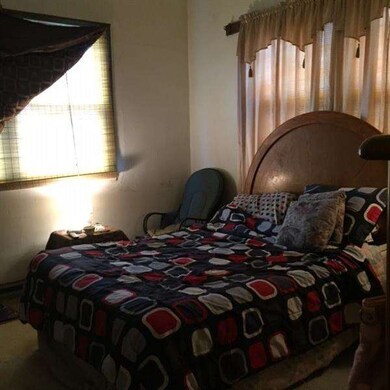 First floor bedroom.  The is damage to one wall th