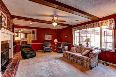 Great Room~Newer Carpet~Fireplace~Chair Rail~Wood 