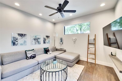 Living room featuring recessed lighting, wood fin