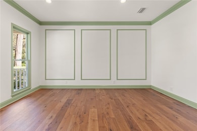 Off the foyer, a spacious room awaits–ideal as an