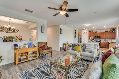 Living room with light wood-type flooring and ceil