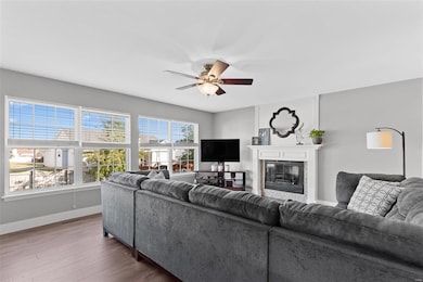 Great Room with WALL OF WINDOWS & Ceiling Fan with