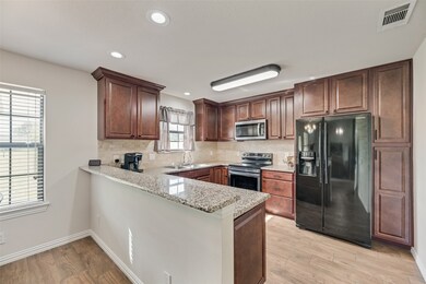 Eat-in kitchen with breakfast bar.