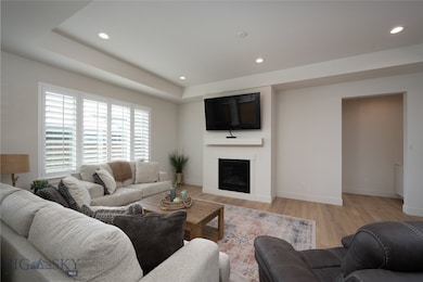 Love the plantation shutters and gas fireplace.