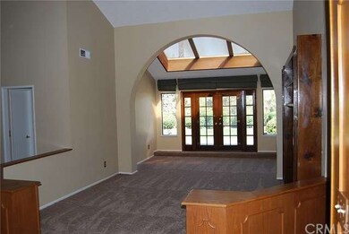 View from the front door to living room & back yar