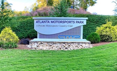 Community sign featuring a lawn