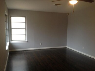 Living room with fresh paint and replaced ceiling 