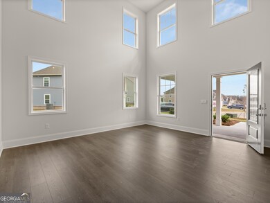 Westerly front foyer with multiple windows for abundant natural light