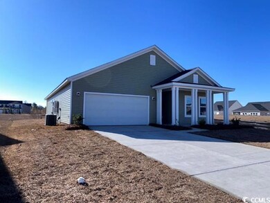 View of front facade featuring a garage and centra