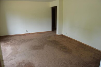 Spacious living room with original hardwood under