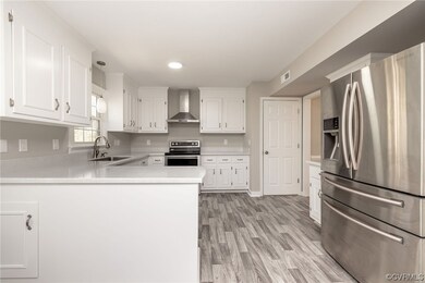 Kitchen with light hardwood / wood-style floors, w