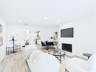 Living area featuring light wood-style floors, a 