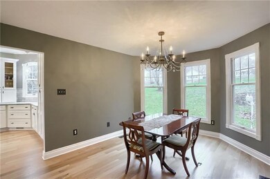 Through French doors, host guests in the dining ro