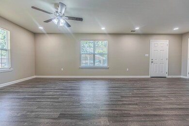 Spare room with hardwood / wood-style flooring and
