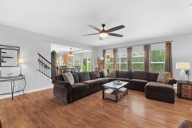 Durable laminate plank floors in the family room make it easy to keep clean!