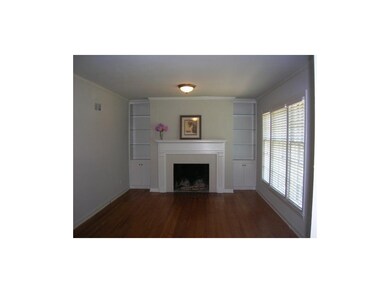 Living Room with WB Fireplace, Built-In Cabinets &