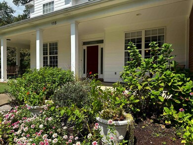 Property entrance featuring covered porch