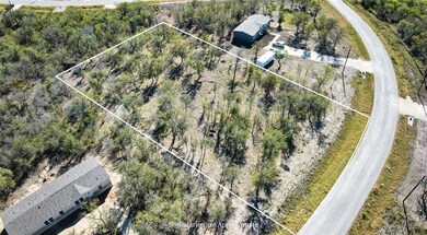 Aerial overview of property's location featuring property parcel outlined