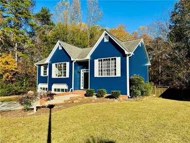 Bi-level home with a front lawn