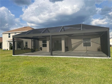 Back of property with a patio, stucco siding, a la