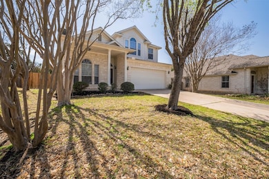 Traditional home featuring fence, driveway, a fro