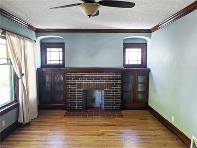 Living Room with Gleaming Wood Floor and Natural Woodwork