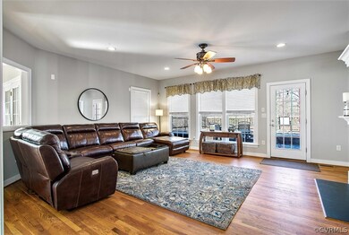 Large family room with double sided fireplace.