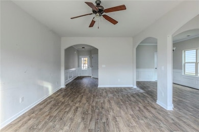 Unfurnished room featuring hardwood / wood-style f
