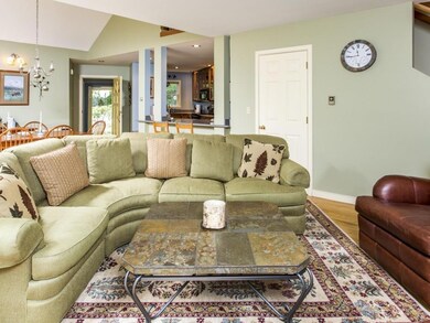 Living room with fireplace and wood...
