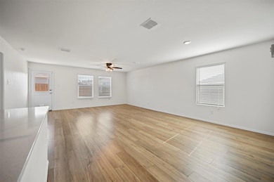 Unfurnished living room featuring light wood-type 