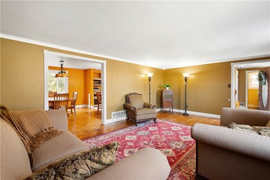 Large Living Area.  Orange Kitchen/Dining Area has